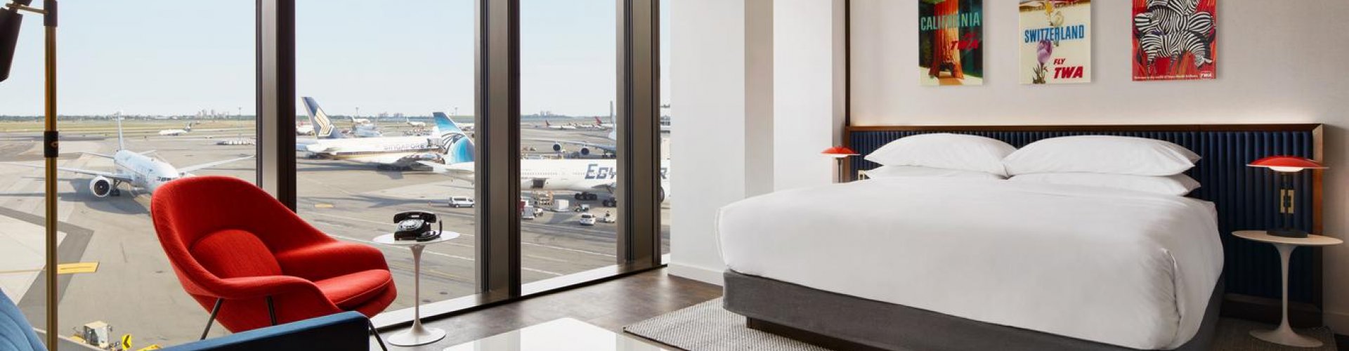 Lush sunset view of JFK Airport from hotel rooftop